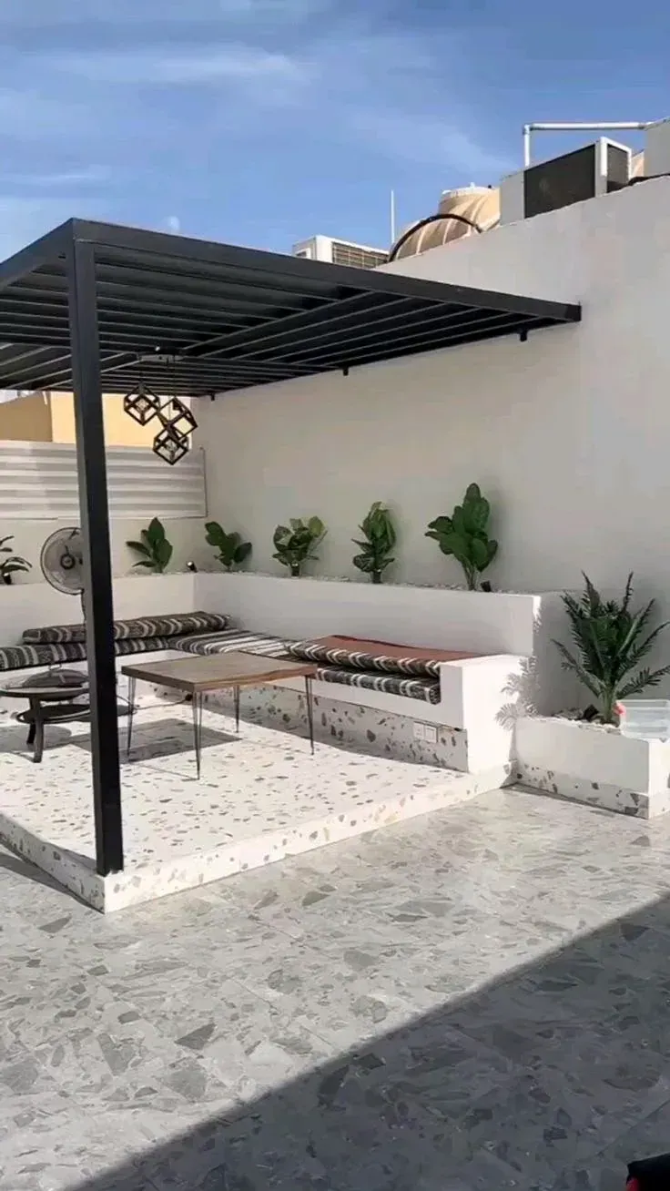SM-SD02 black steel pergola over a seating area on a roof terrace